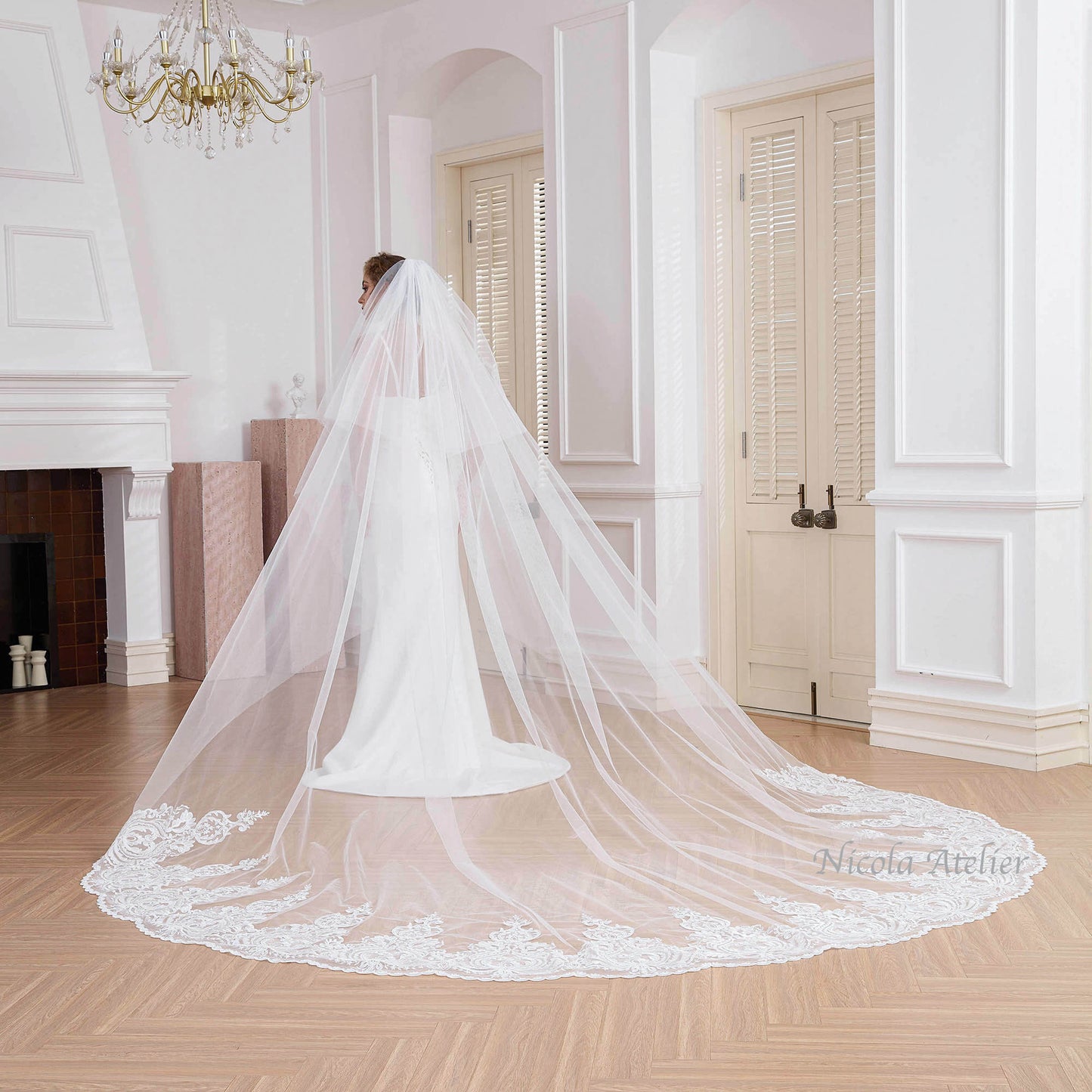Back view of extra wide cathedral veil with baroque lace hem sweeping wooden floor Nicola Xu Atelier.